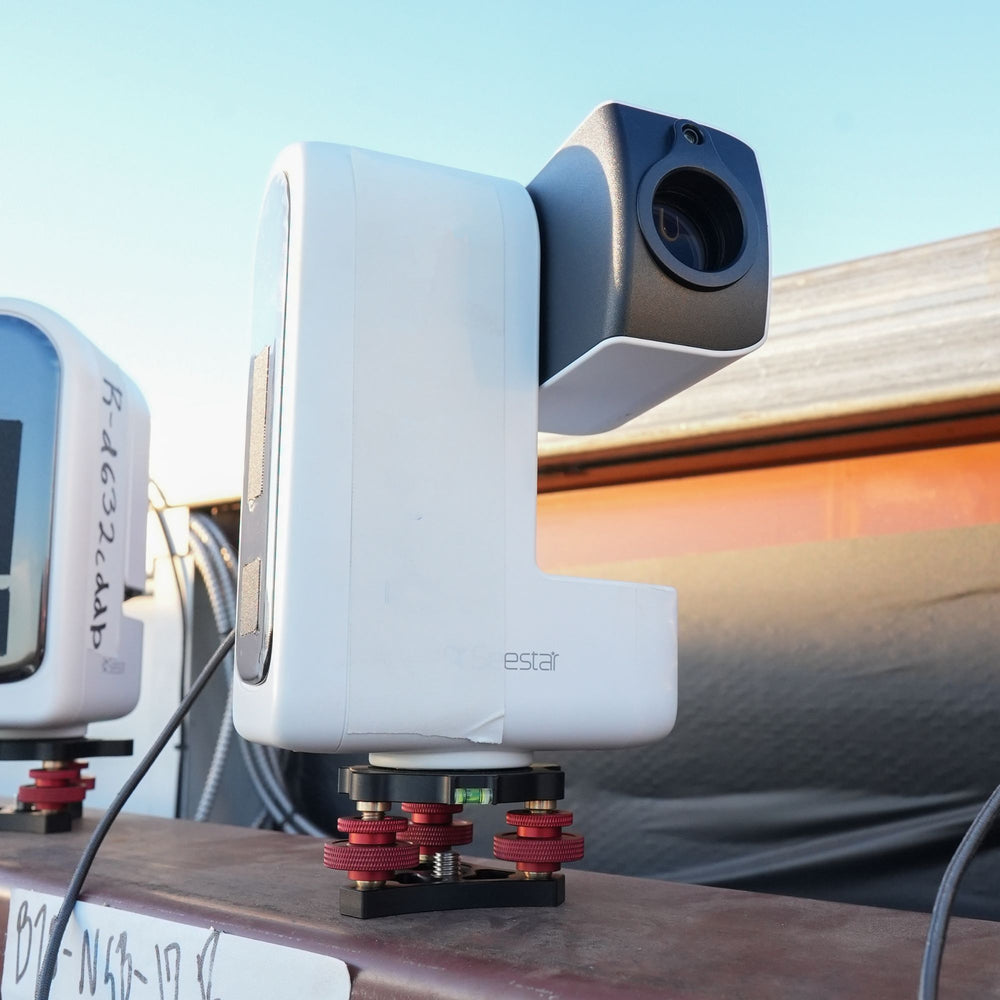 A Starfront-owned ZWO Seestar smart telescope on its mount at sunset